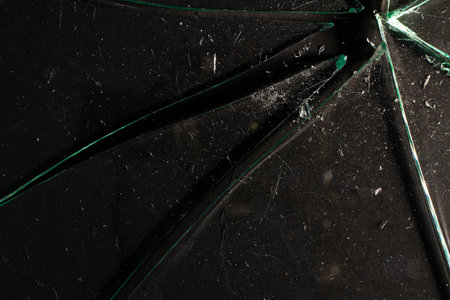 Broken glass on a dark backgroundの写真素材