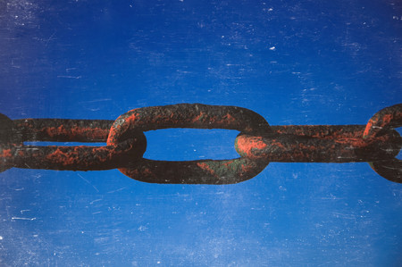 Rusted chain on grey background. Strong connection between cells.