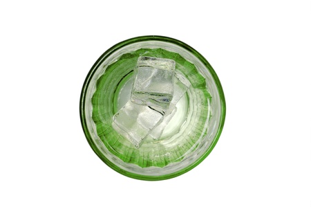 glass with green liquid and ice cubes isolated in white background top viewの写真素材