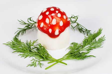 decoratively issued egg as a fly agaric with fresh fennelの写真素材