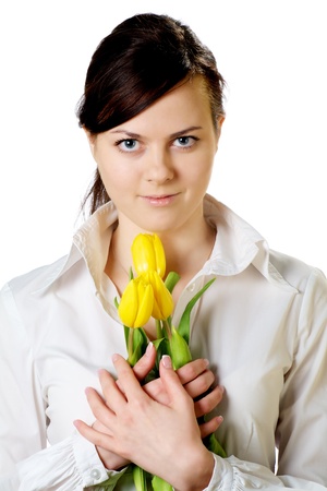 smiling girl with yellow tulips bouquet isolated on whiteの写真素材
