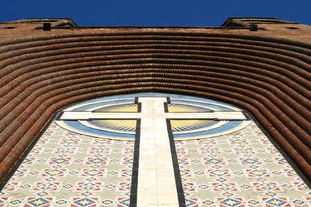 cross on the facade wall of christianity cathedral dome の写真素材