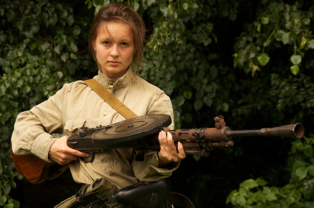 girl with gun on celebration of 750 anniversary of Guryevsk (Neuhausen O.P.) on June 30, 2012 in Guryevsk, Kaliningradskaya oblast, Russiaのeditorial素材