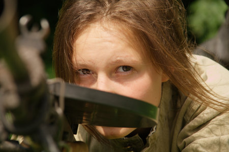girl with gun on celebration of 750 anniversary of Guryevsk (Neuhausen O.P.) on June 30, 2012 in Guryevsk, Kaliningradskaya oblast, Russiaのeditorial素材