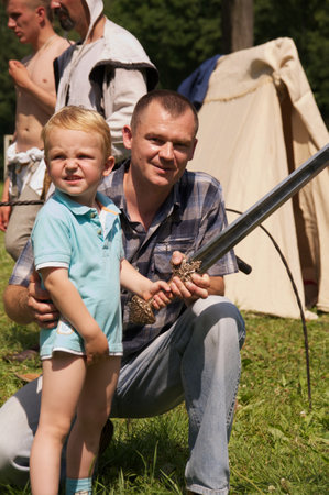 kid with sword on celebration of 750 anniversary of Guryevsk (Neuhausen O.P.) on June 30, 2012 in Guryevsk, Kaliningradskaya oblast, Russiaのeditorial素材