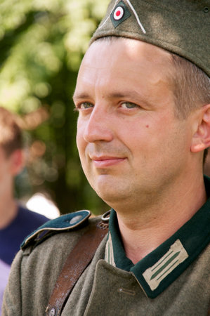 man in form of nazi smiling on celebration of 750 anniversary of Guryevsk (Neuhausen O.P.) on June 30, 2012 in Guryevsk, Kaliningradskaya oblast, Russiaのeditorial素材