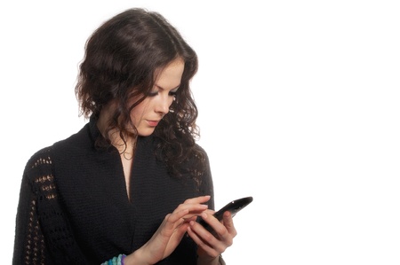 serious girl with noname smartphone isolated on white backgroundの写真素材