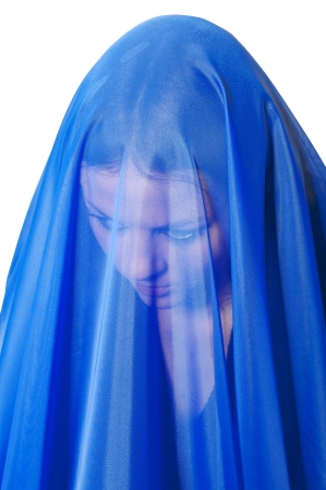 sad girl in blue veli isolated on white backgroundの写真素材
