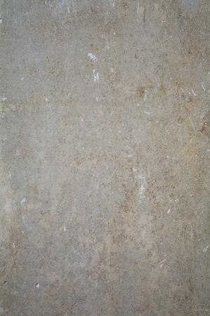 old gray concrete wall texture with paper piecesの写真素材