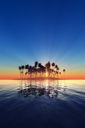 silhouette of island in tropical tranquil sea with Palm trees and sun set rays behind them verticalの写真素材