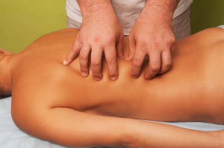 position of hand at massage of a female bodyの写真素材