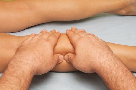 position of hands and fingers at massage of a female bodyの写真素材