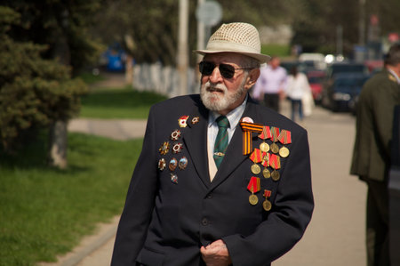 Kaliningrad, Russia - May 05, 2013 - veteran of the World War with his medals walk at street on during the victory celebrationのeditorial素材