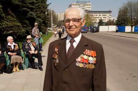 Kaliningrad, Russia - May 05, 2013 - veteran of the World War with his medals walk at street on during the victory celebrationのeditorial素材
