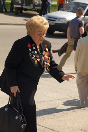 Kaliningrad, Russia - May 05, 2013 - woman veteran of the World War with medals walk at street on during the victory celebrationのeditorial素材