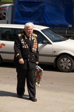 Kaliningrad, Russia - May 05, 2013 - veteran of the World War with medals walk at street on during the victory celebrationのeditorial素材