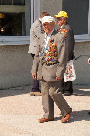 Kaliningrad, Russia - May 05, 2013 - veteran of the World War with medals walk at street on during the victory celebrationのeditorial素材