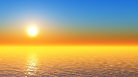sun in clear sky behind tranquil tropical seaの写真素材