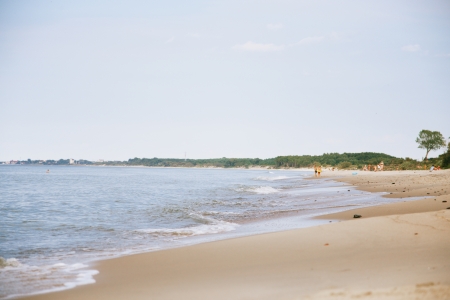 baltic sea wild beach with unrecognized peopleの写真素材