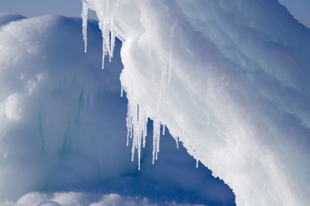 ice mountains with icicles at sunset lightの写真素材