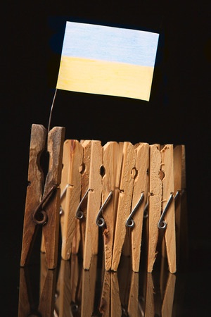 clothespin team with old leader and flag of Ukraineの写真素材
