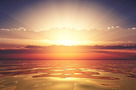 golden sea at sunset with cloudsの写真素材