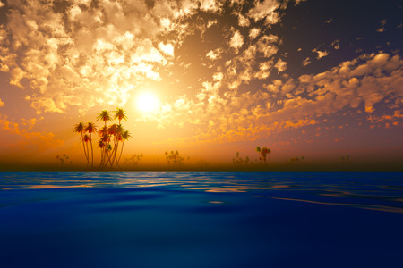 gold sunset in clouds over coconut tropic islandsの写真素材