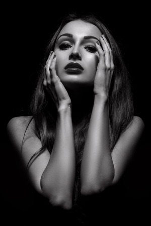 luxury girl topless on dark background, monochrome imageの写真素材