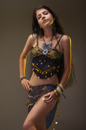 smile girl in eastern dress posingの写真素材