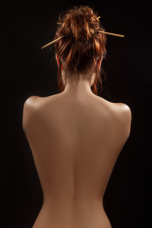 perfectly female back on black backgroundの写真素材