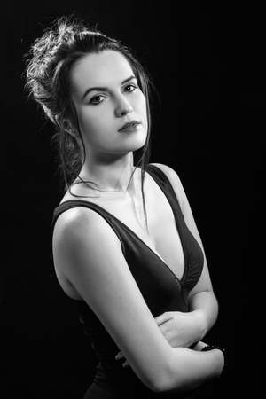 sensual young woman portrait on black background monochrome imageの写真素材