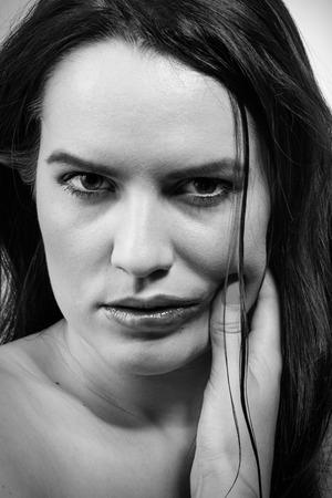 sad woman with smeared make up, monochrome imageの写真素材