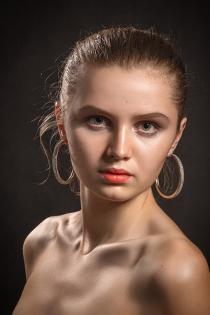 beautiful young woman with bare shoulders portraitの写真素材
