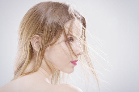 sad young woman profileの写真素材