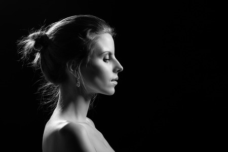 perfect female profile on black background, monochromeの写真素材