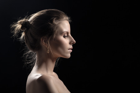 perfect female profile on black backgroundの写真素材