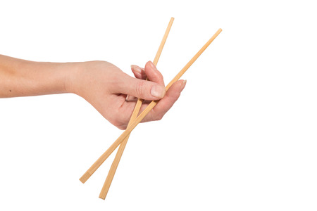 female hand with chopsticks, isolatedの写真素材