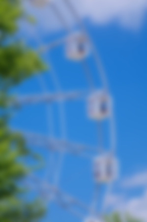 amusement park entertainment - observing wheel blurred background