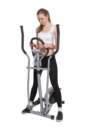 young slim woman check cardio pulse after exercising isolatedの写真素材
