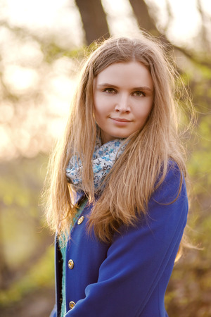 attractive woman with long hair on nature backgroundの写真素材