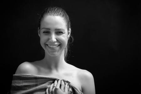 happy woman laughing with bare shoulders monochromeの写真素材