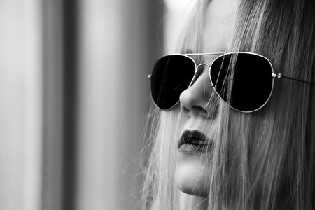 beautiful blond girl in black sunglasses monochromeの写真素材