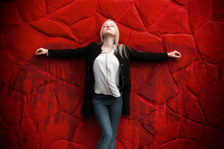 girl with blood wings on red backgroundの写真素材