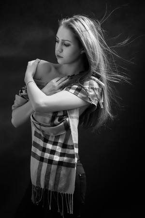 pensive sensual girl with bared shoulders monochromeの写真素材