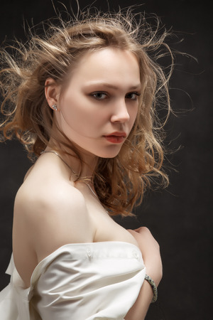 pretty girl with fluffy hair on black backgroundの写真素材