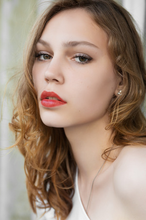 sensual serious woman with bared shoulderの写真素材