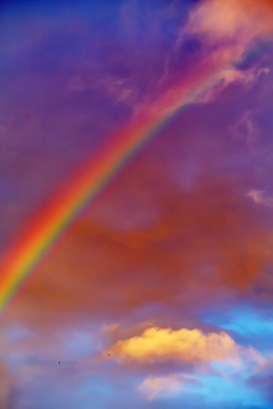 rainbow over clouds dramatic viewの写真素材