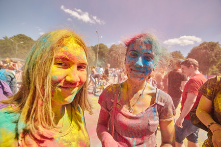 KALININGRAD, RUSSIA - JUNE 12, 2015: People with painted faces during the Holi Festival of Colors. Holi is a festival celebrated as a festival of coloursのeditorial素材