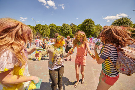 KALININGRAD, RUSSIA - JUNE 12, 2015: People with painted faces during the Holi Festival of Colors. Holi is a festival celebrated as a festival of coloursのeditorial素材