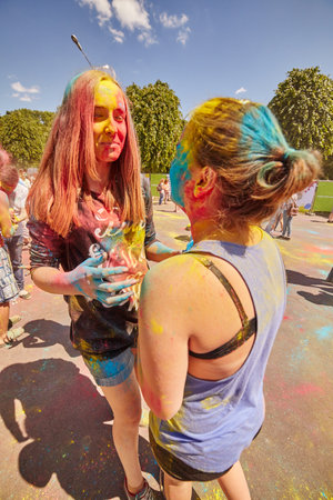 KALININGRAD, RUSSIA - JUNE 12, 2015: People with painted faces during the Holi Festival of Colors. Holi is a festival celebrated as a festival of coloursのeditorial素材